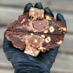 Nutella-filled cookie with peanuts and chocolate chips